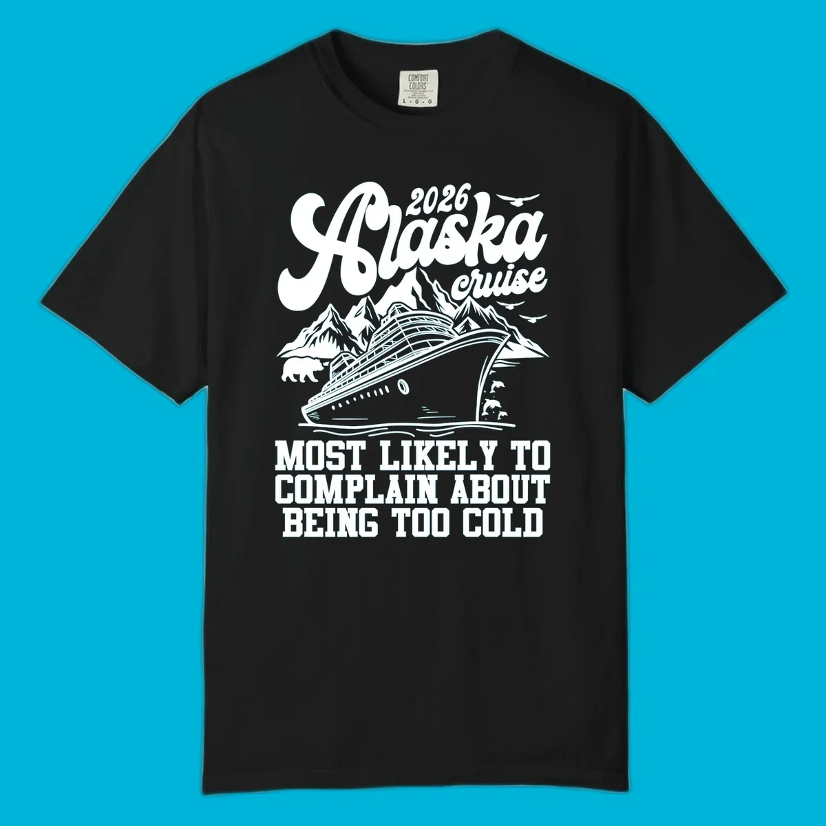 A white design on a black background of a cruise ship, mountains, bear, dolphins, and text "2026 Alaska cruise MOST LIKELY TO COMPLAIN ABOUT BEING TOO COLD".