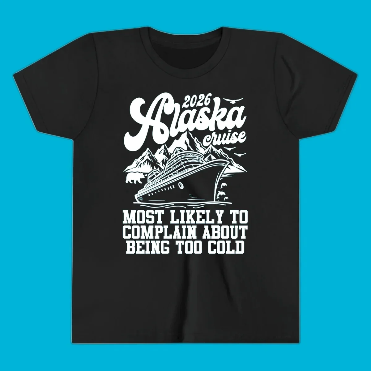 A white design on a black background of a cruise ship, mountains, bear, dolphins, and text "2026 Alaska cruise MOST LIKELY TO COMPLAIN ABOUT BEING TOO COLD".