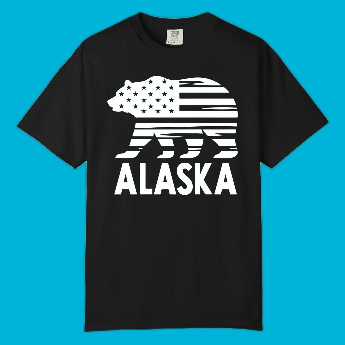 A white bear silhouette filled with the American flag and the text ALASKA. Represents an alaska-flag-bear.