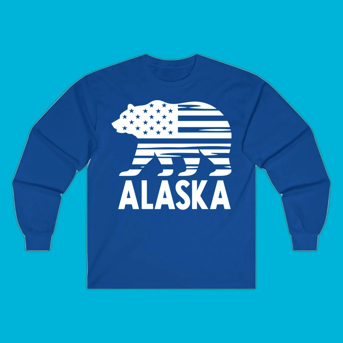 A white bear silhouette filled with the American flag and the text ALASKA. Represents an alaska-flag-bear.