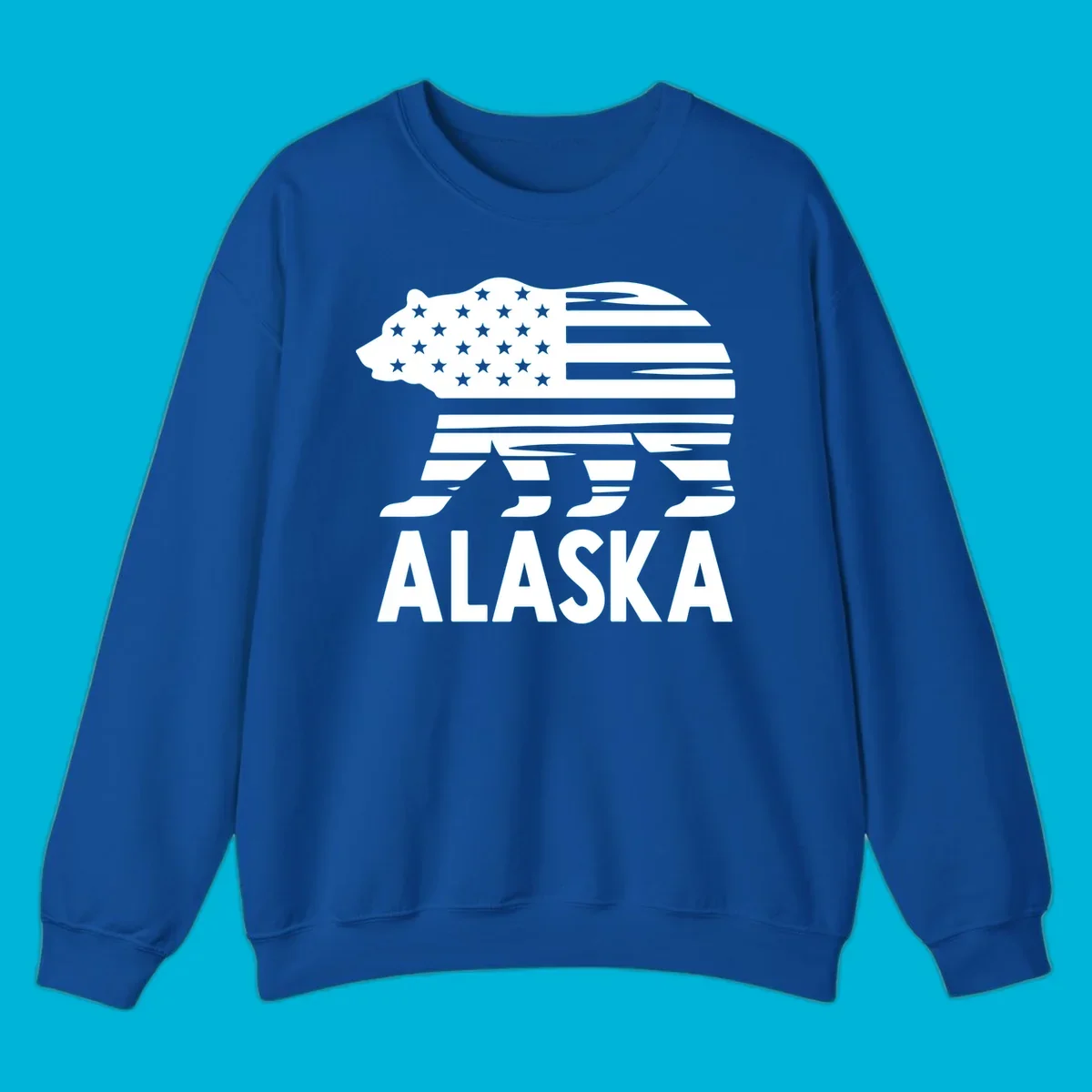 A white bear silhouette filled with the American flag and the text ALASKA. Represents an alaska-flag-bear.