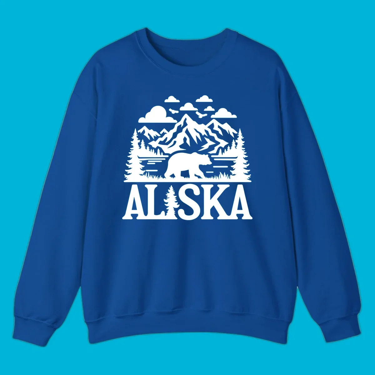 Graphic of an alaska-bear-mountain-view with a bear, mountains, forest, a lake, clouds, and birds, with 'ALASKA' text.