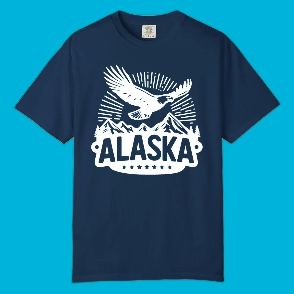 Vintage style Alaska eagle mountain view design with a soaring bald eagle over mountains and pine trees, with ALASKA text.