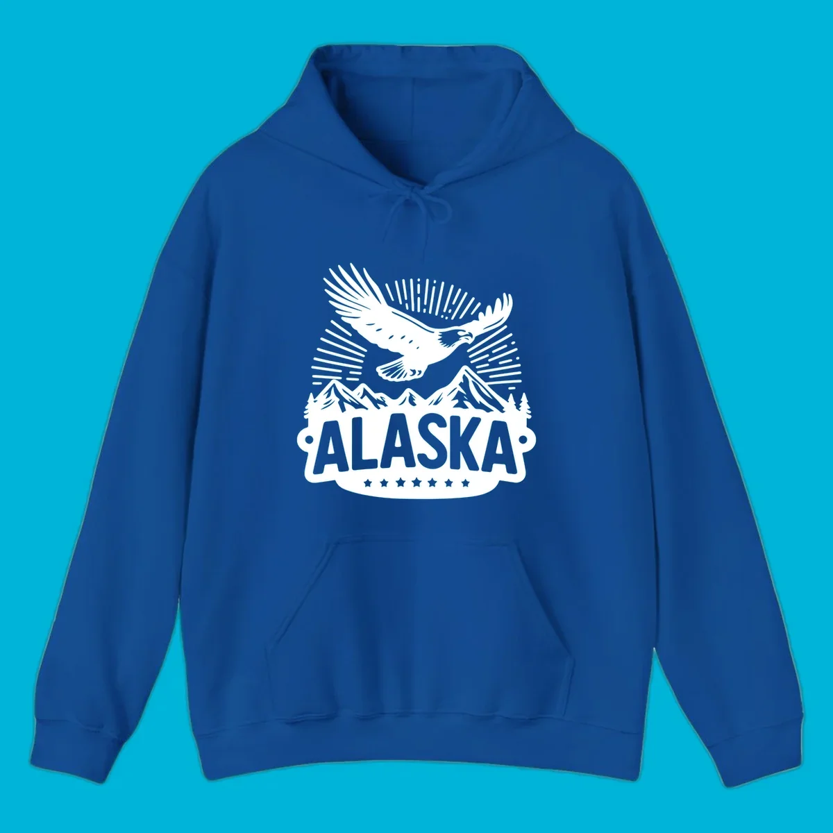 Vintage style Alaska eagle mountain view design with a soaring bald eagle over mountains and pine trees, with ALASKA text.