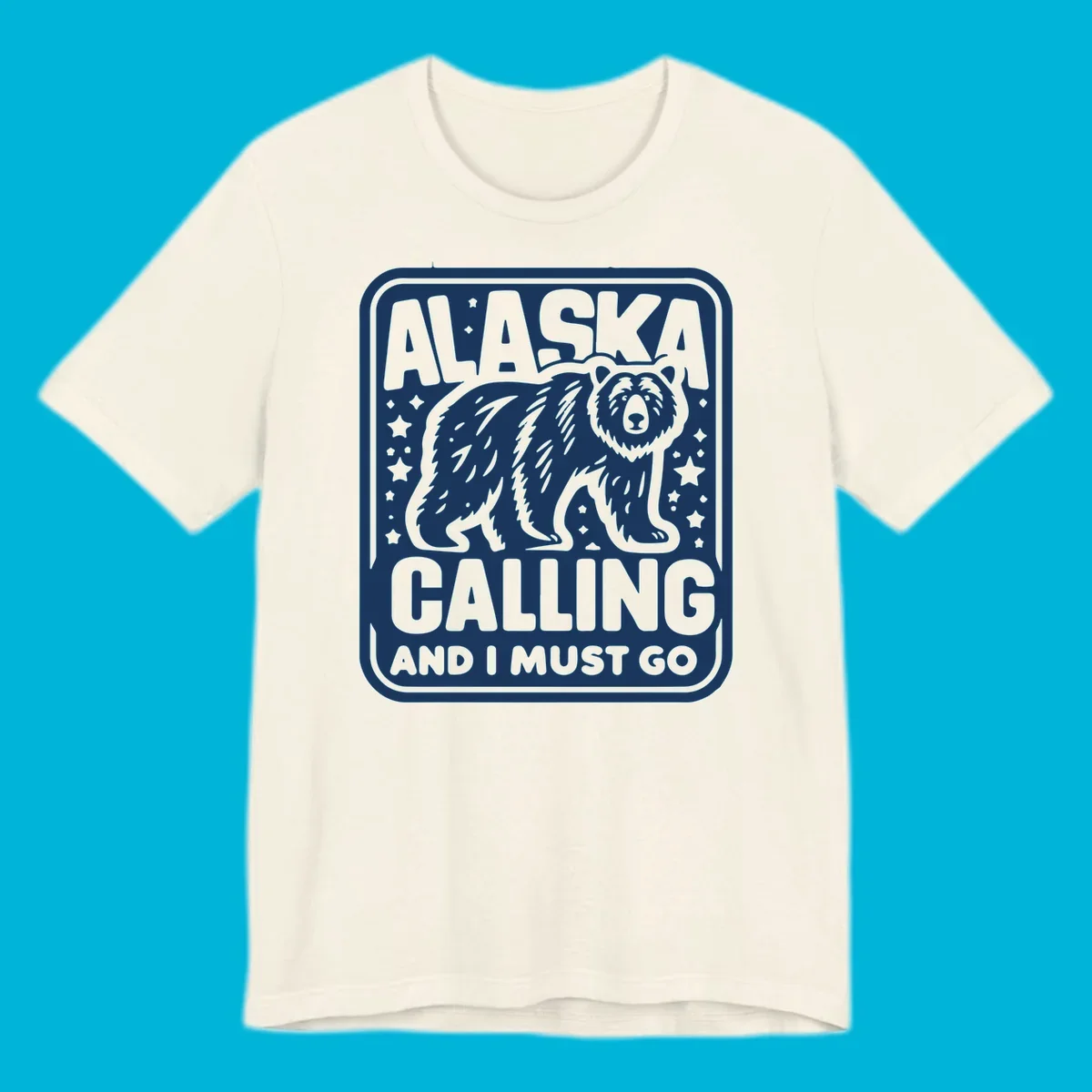 A vintage-style illustration of a bear with stars and the text 'ALASKA CALLING AND I MUST GO'.