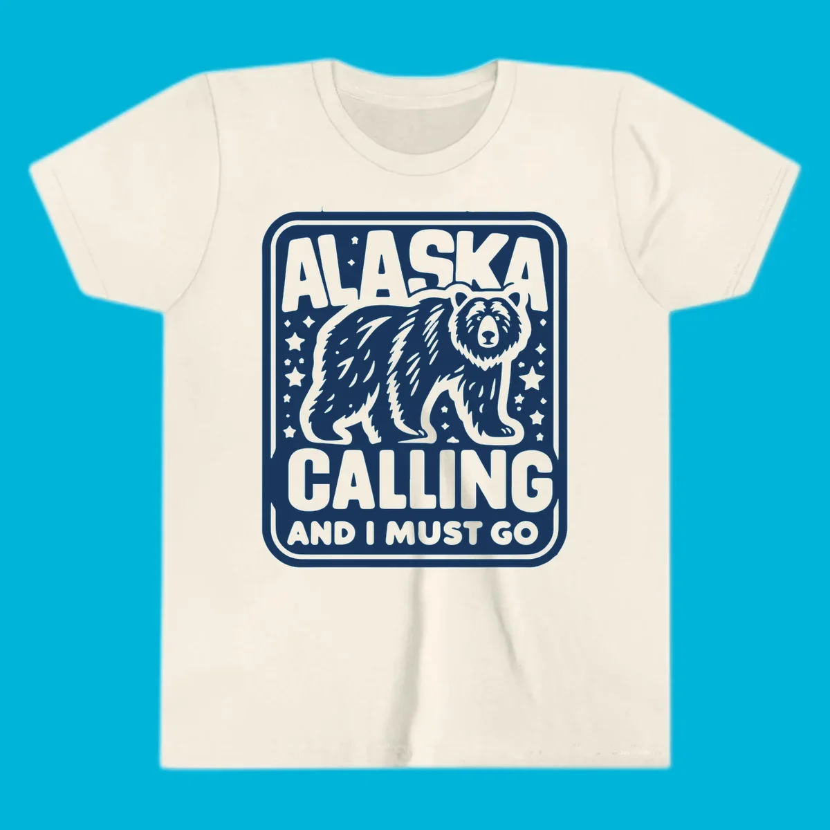A vintage-style illustration of a bear with stars and the text 'ALASKA CALLING AND I MUST GO'.
