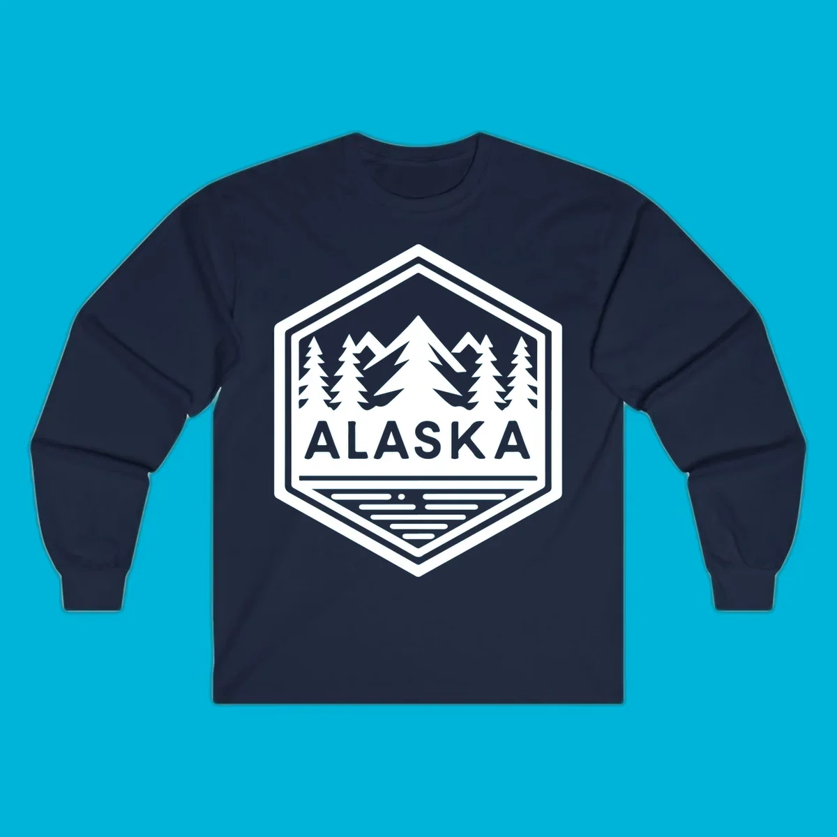 An Alaska mountain lake badge design in a hexagon shape, showing mountains, pine trees, and a lake below the ALASKA text.