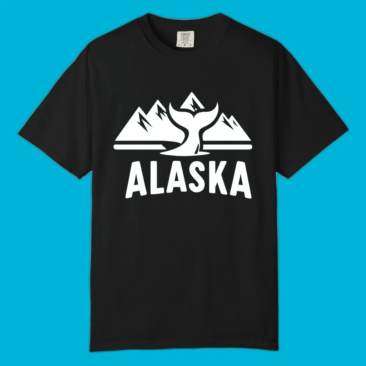 A scenic Alaska mountains whale tail design with three peaks and a whale's fluke above the word ALASKA.