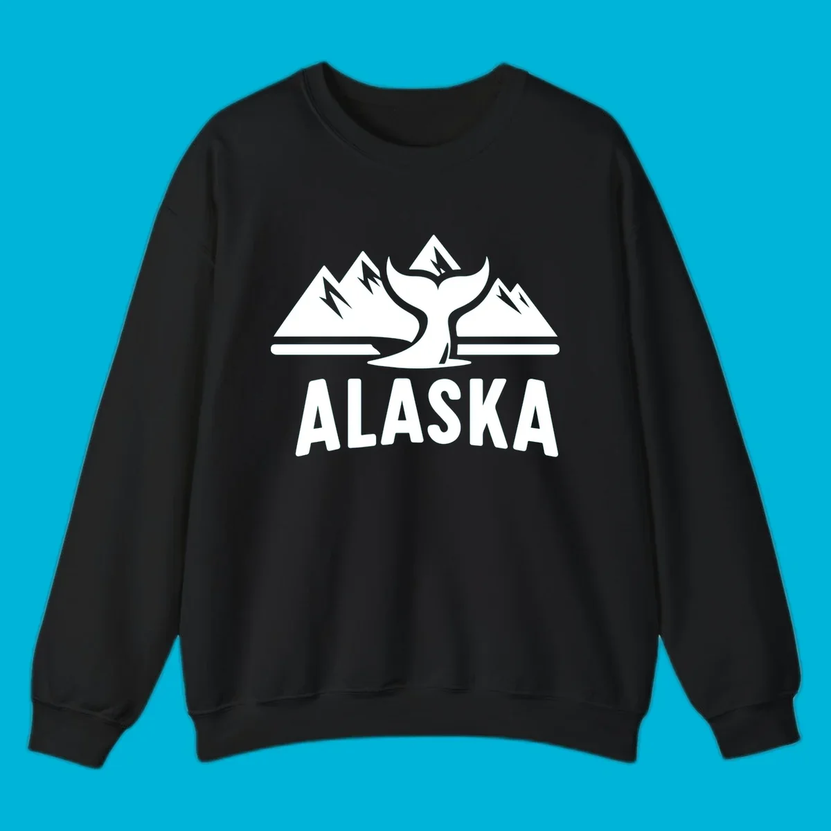 A scenic Alaska mountains whale tail design with three peaks and a whale's fluke above the word ALASKA.