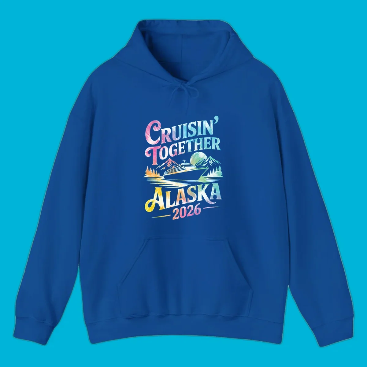 A tie-dye graphic featuring a cruise ship, mountains, and trees, with the text 'CRUISIN' TOGETHER ALASKA 2026'. This alaska-cruise-2026-tie-dye design shows a scenic view.