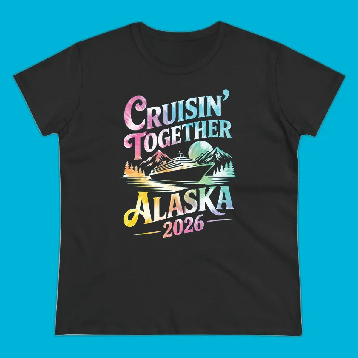 A tie-dye graphic featuring a cruise ship, mountains, and trees, with the text 'CRUISIN' TOGETHER ALASKA 2026'. This alaska-cruise-2026-tie-dye design shows a scenic view.