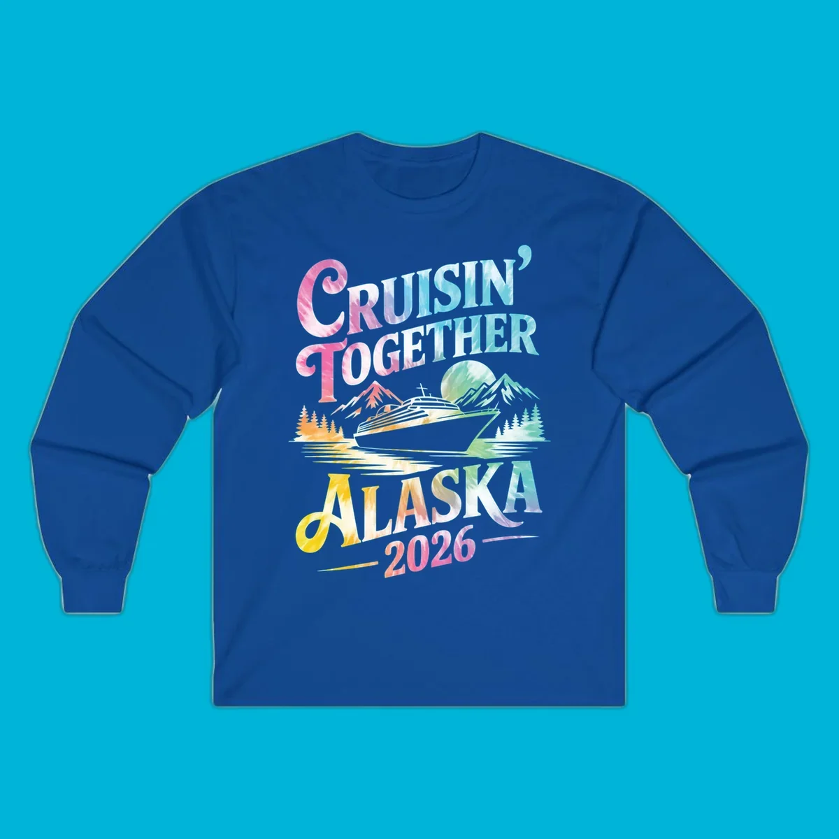A tie-dye graphic featuring a cruise ship, mountains, and trees, with the text 'CRUISIN' TOGETHER ALASKA 2026'. This alaska-cruise-2026-tie-dye design shows a scenic view.