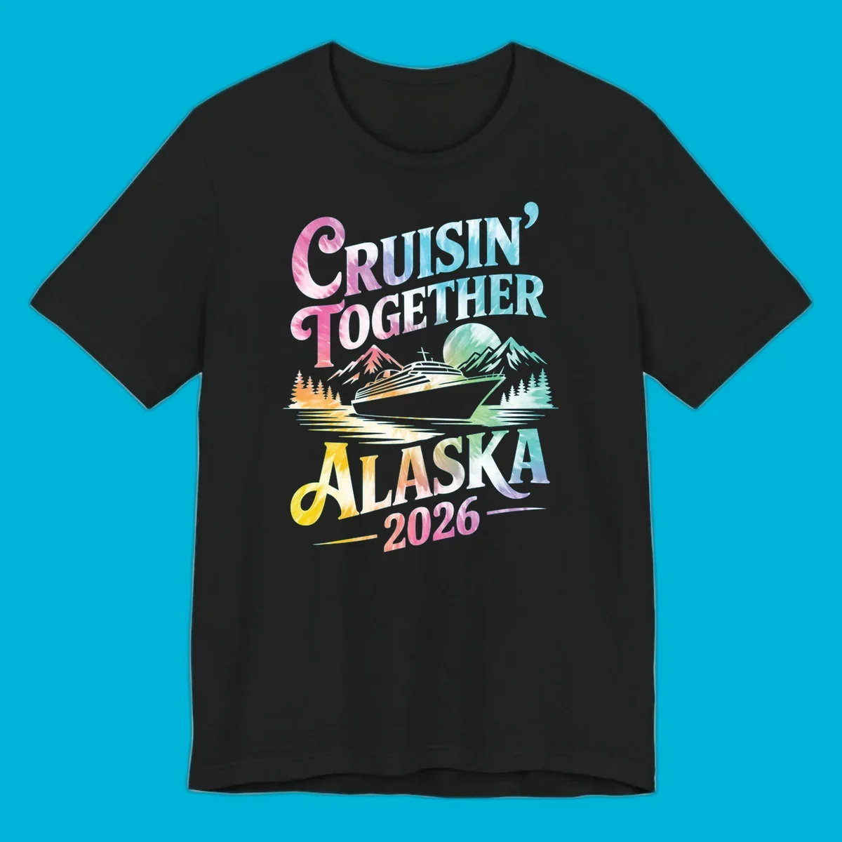 A tie-dye graphic featuring a cruise ship, mountains, and trees, with the text 'CRUISIN' TOGETHER ALASKA 2026'. This alaska-cruise-2026-tie-dye design shows a scenic view.