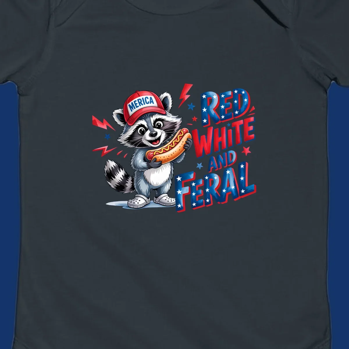 A cartoon raccoon wearing a 'MERICA' hat and holding a hot dog, next to text 'RED WHITE AND FERAL'. This is a raccoon-red-white-feral design.
