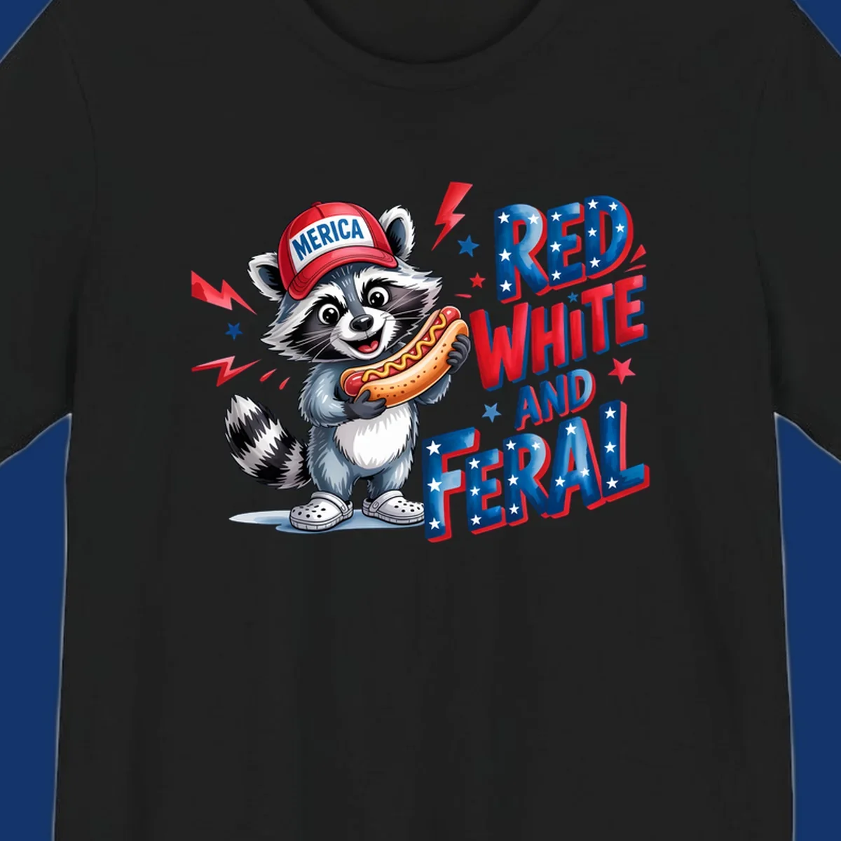 A cartoon raccoon wearing a 'MERICA' hat and holding a hot dog, next to text 'RED WHITE AND FERAL'. This is a raccoon-red-white-feral design.