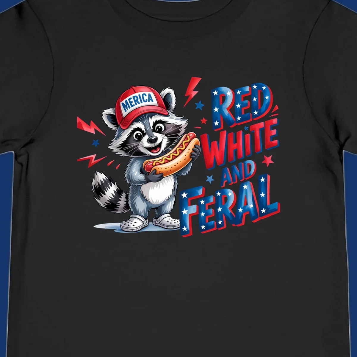 A cartoon raccoon wearing a 'MERICA' hat and holding a hot dog, next to text 'RED WHITE AND FERAL'. This is a raccoon-red-white-feral design.