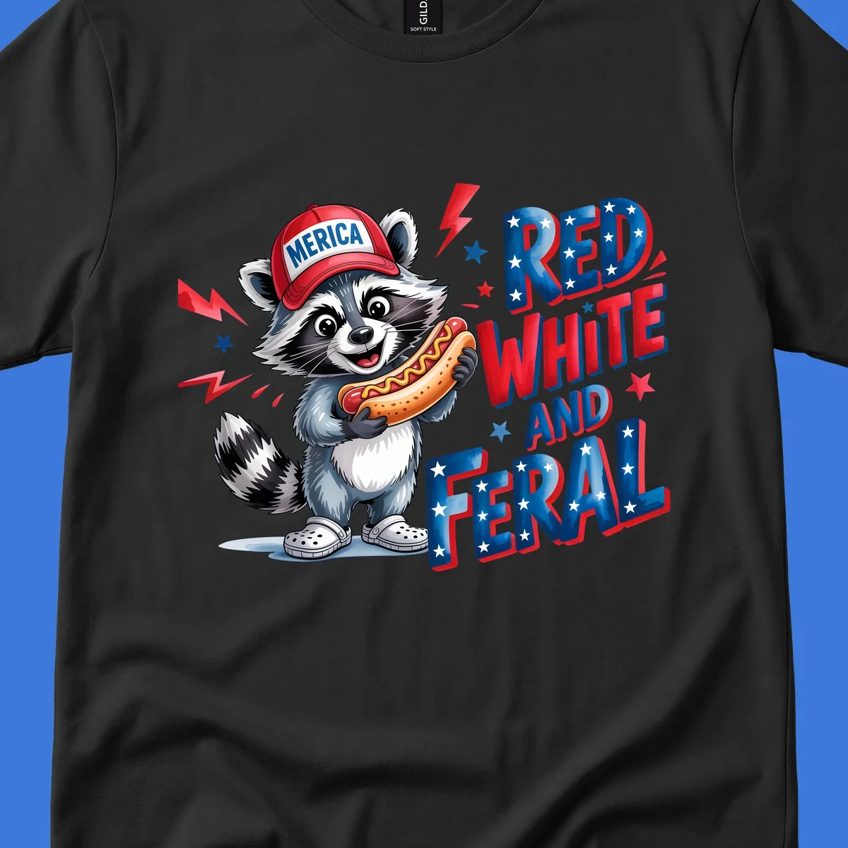 A cartoon raccoon wearing a 'MERICA' hat and holding a hot dog, next to text 'RED WHITE AND FERAL'. This is a raccoon-red-white-feral design.