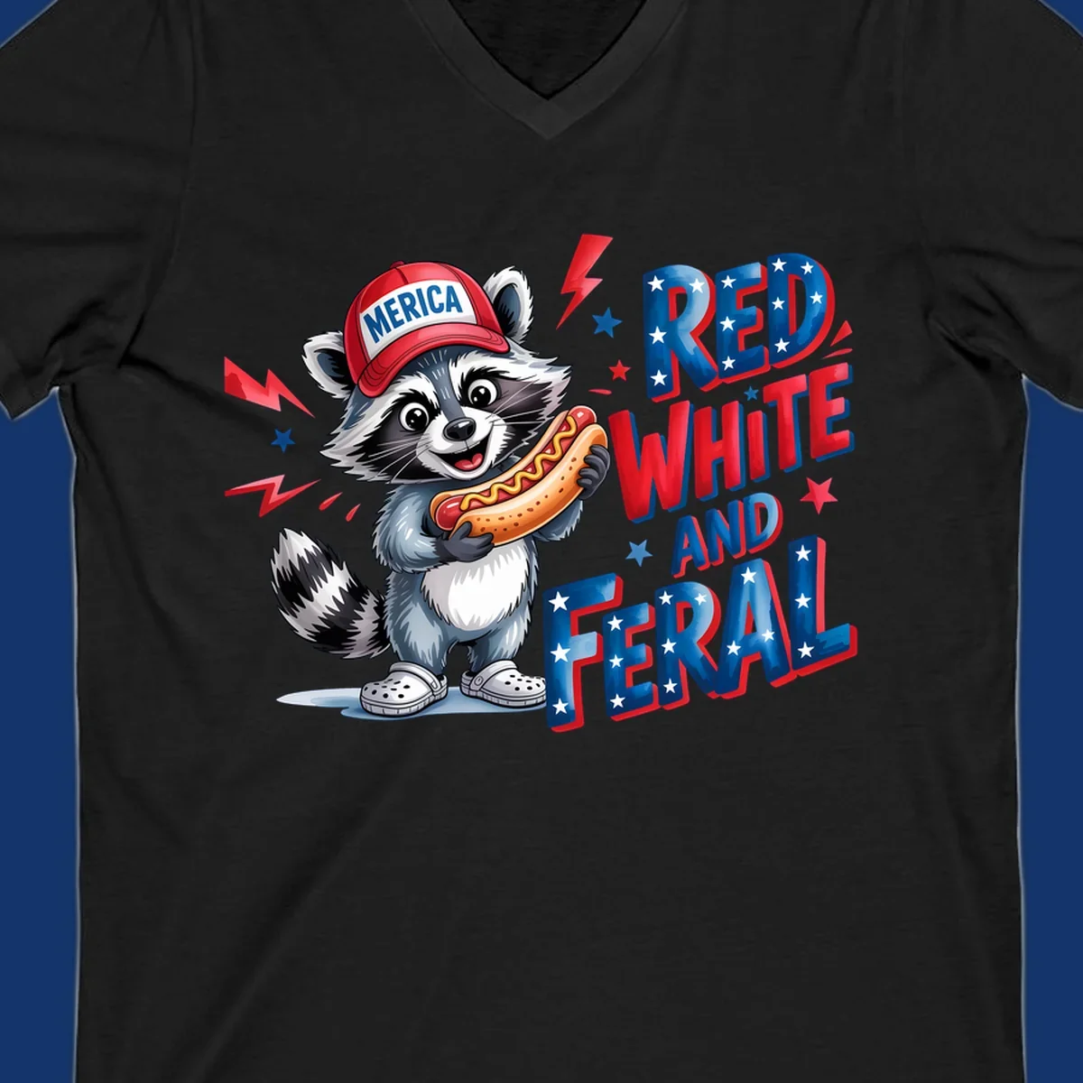 A cartoon raccoon wearing a 'MERICA' hat and holding a hot dog, next to text 'RED WHITE AND FERAL'. This is a raccoon-red-white-feral design.