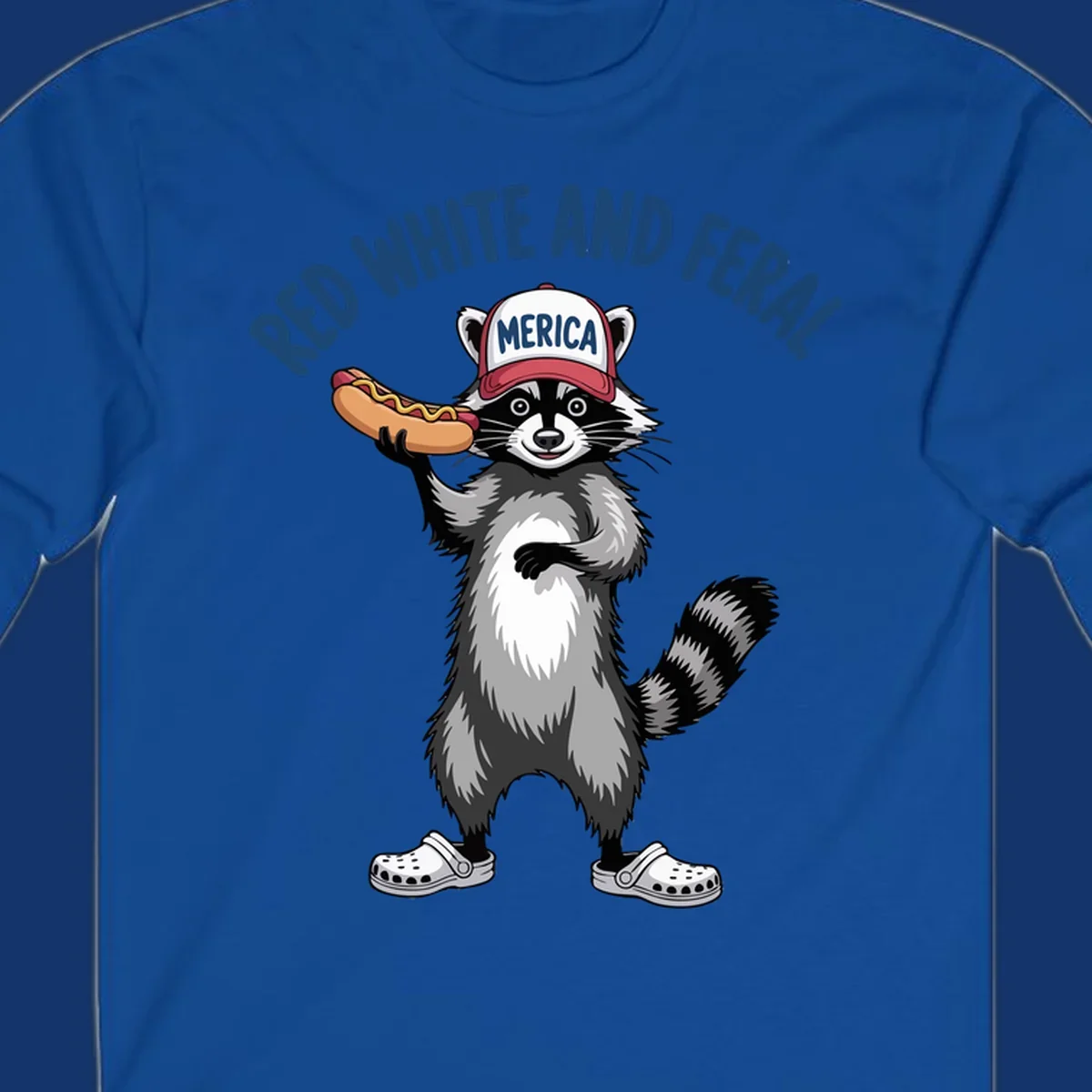 A patriotic raccoon in a MERICA hat and Crocs holds a hot dog, with 'RED WHITE AND FERAL' text. Features the red-white-feral-raccoon concept.