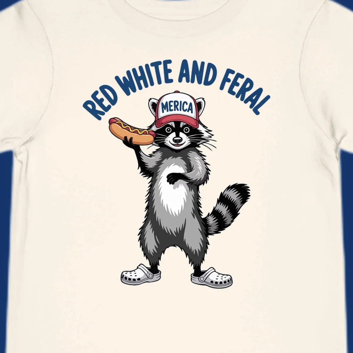 A patriotic raccoon in a MERICA hat and Crocs holds a hot dog, with 'RED WHITE AND FERAL' text. Features the red-white-feral-raccoon concept.