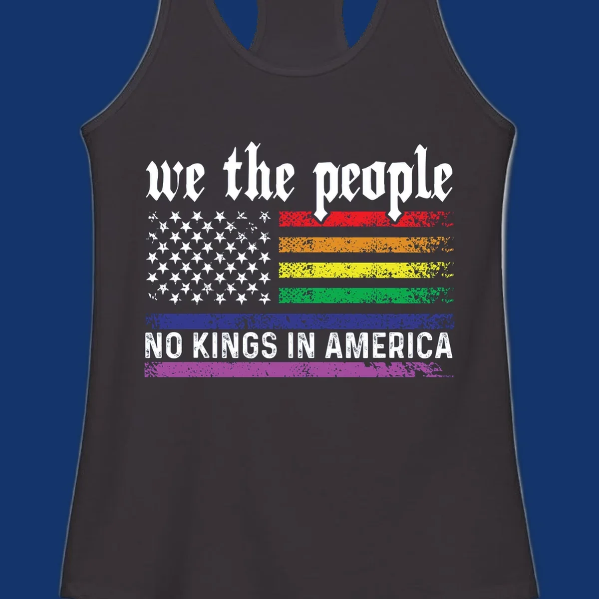 A distressed American flag with rainbow stripes and white stars, featuring 'we the people' and 'NO KINGS IN AMERICA' text.
