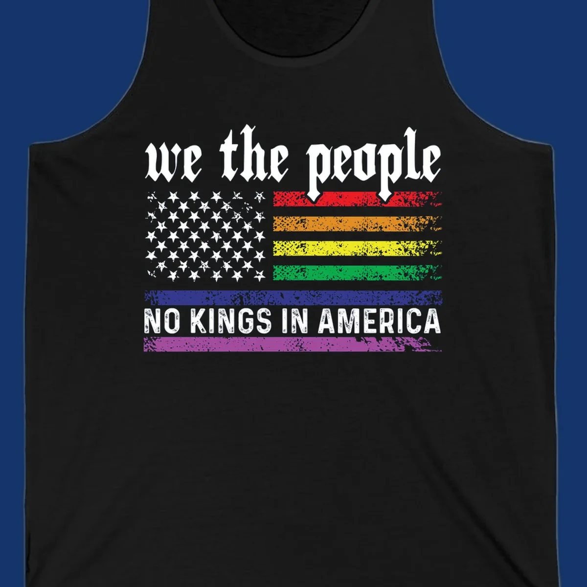 A distressed American flag with rainbow stripes and white stars, featuring 'we the people' and 'NO KINGS IN AMERICA' text.