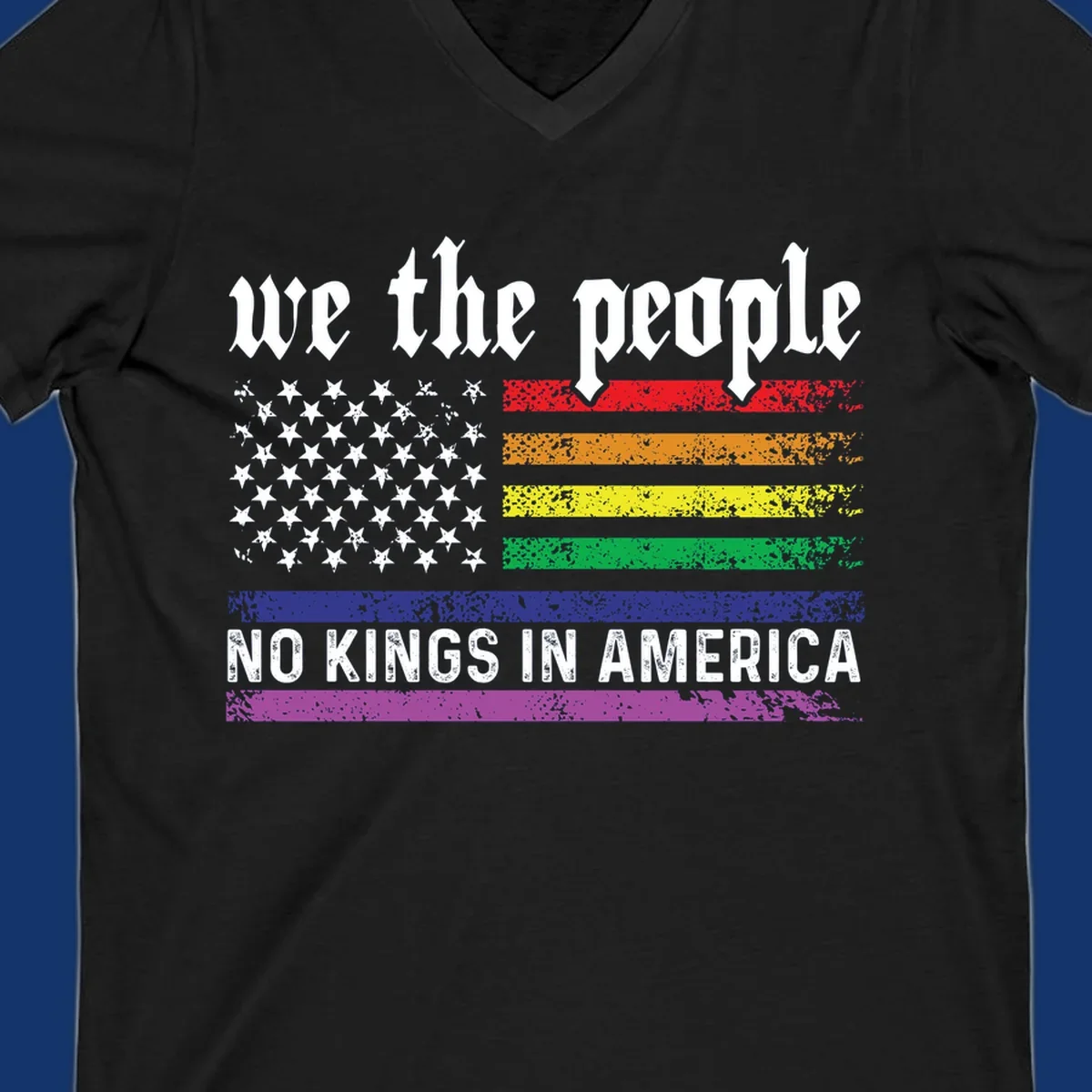 A distressed American flag with rainbow stripes and white stars, featuring 'we the people' and 'NO KINGS IN AMERICA' text.