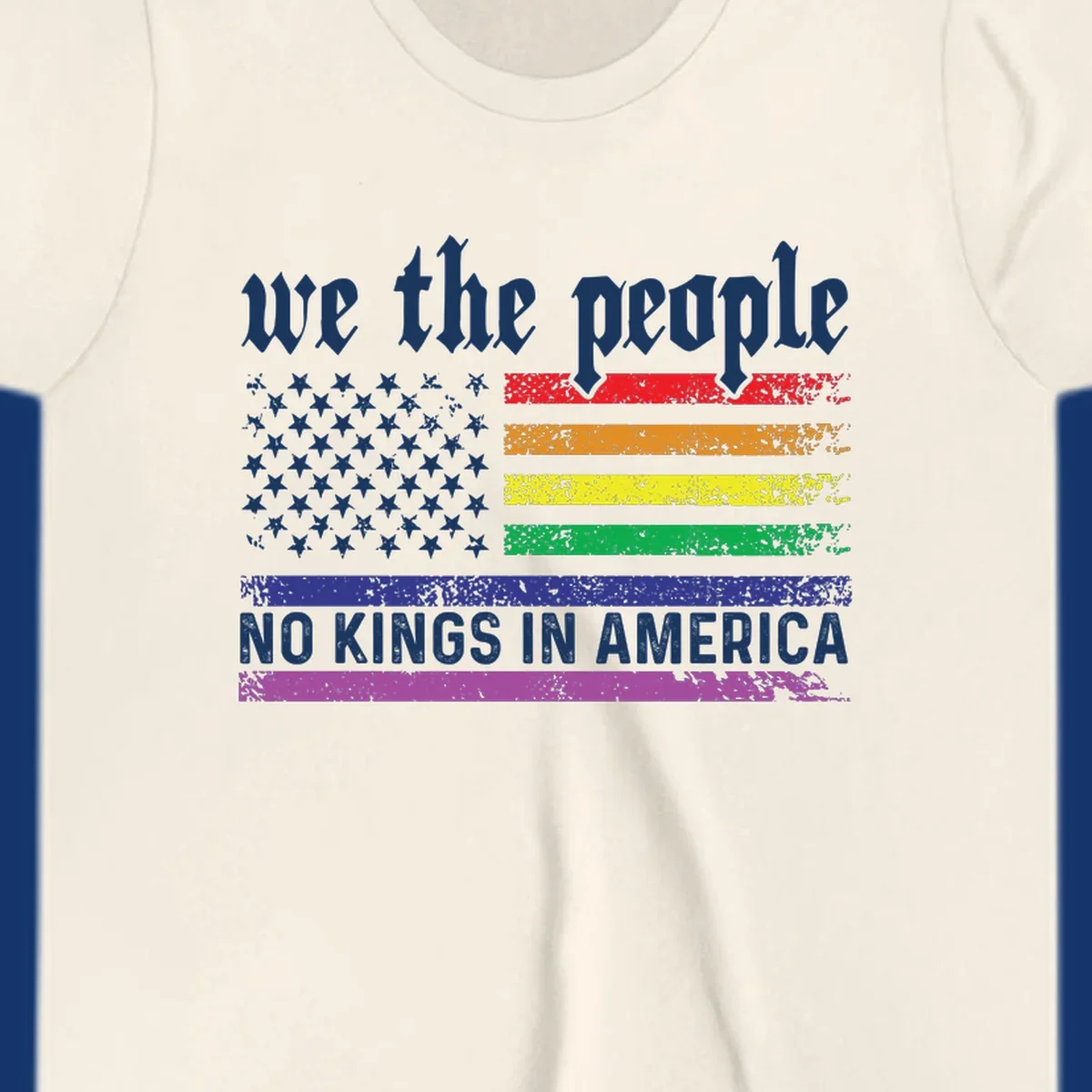 A distressed American flag with rainbow stripes and white stars, featuring 'we the people' and 'NO KINGS IN AMERICA' text.