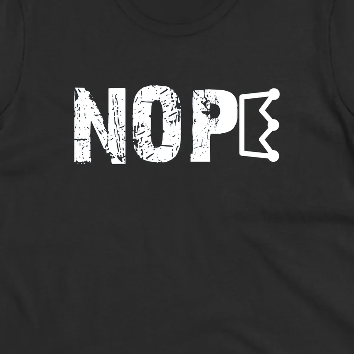 A distressed 'NOPE' text design where the 'E' is a crown outline, clean on all garment colors.