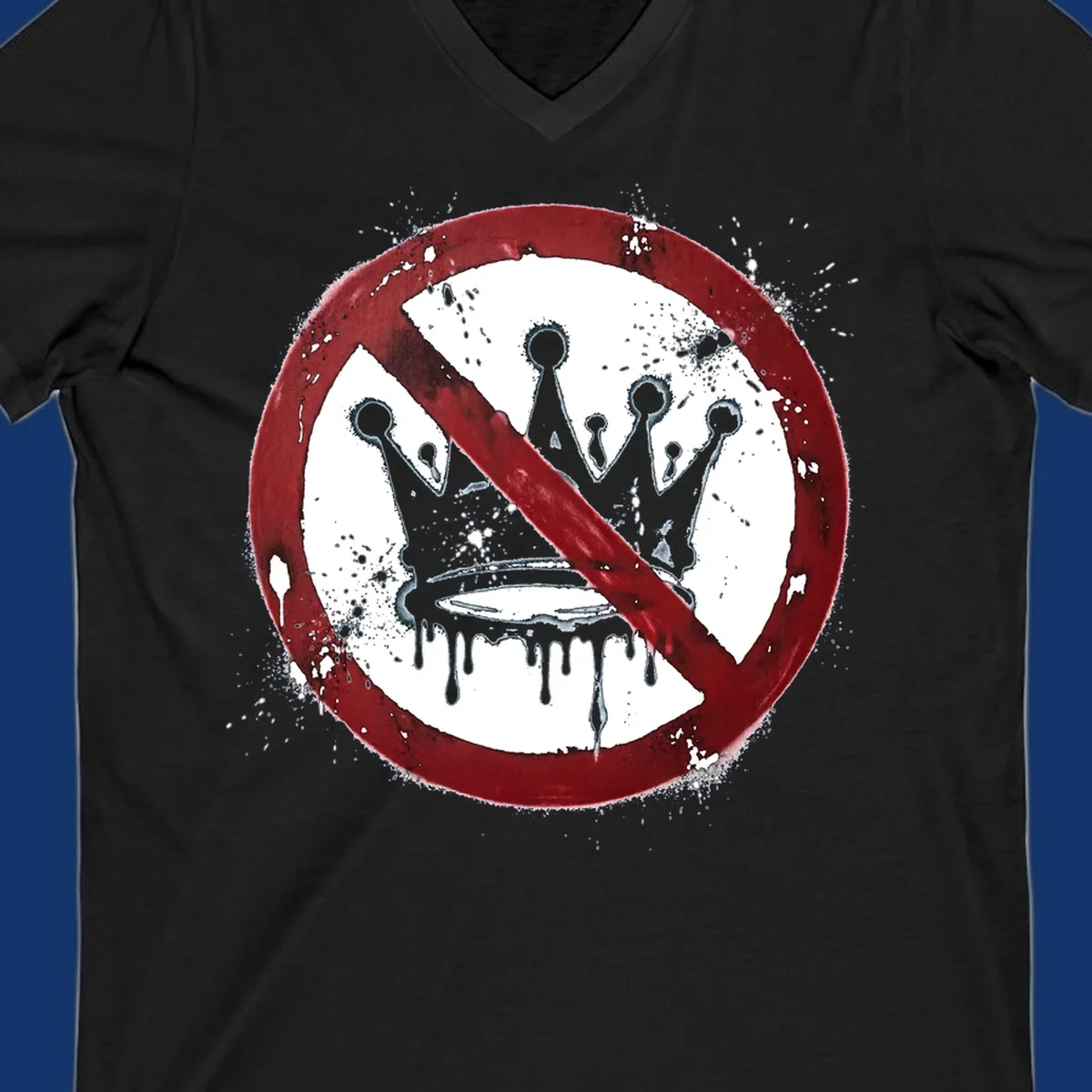 A red 'no' symbol crosses out a dripping crown with paint splatters, representing no-crown-anti-monarchy.
