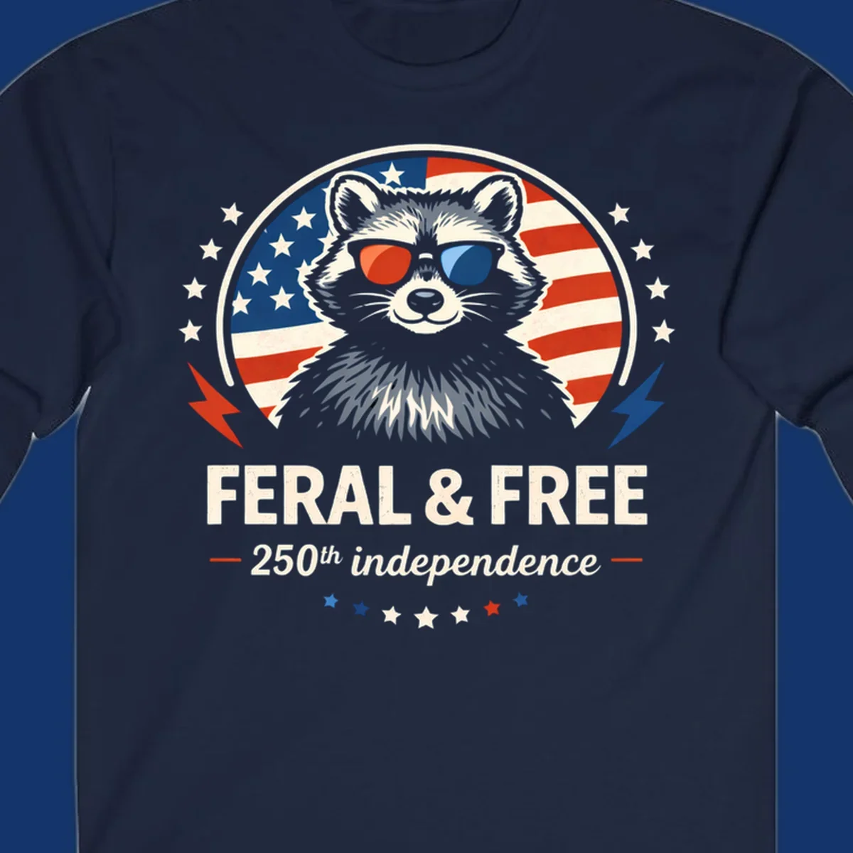 A patriotic design with a raccoon in red and blue sunglasses against an American flag, with text 'Feral & Free 250th Independence'.
