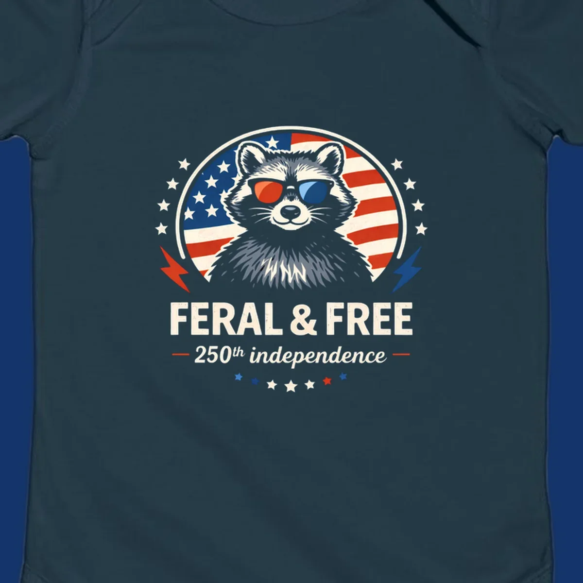A patriotic design with a raccoon in red and blue sunglasses against an American flag, with text 'Feral & Free 250th Independence'.