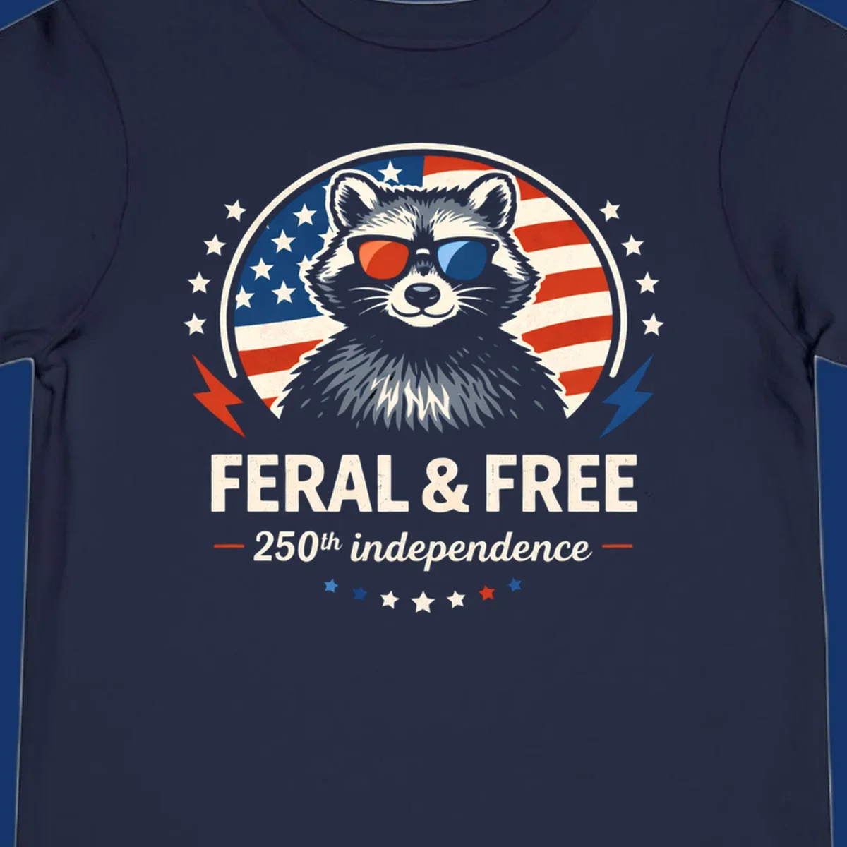 A patriotic design with a raccoon in red and blue sunglasses against an American flag, with text 'Feral & Free 250th Independence'.