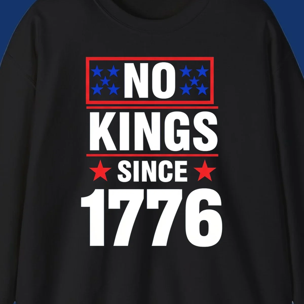 A patriotic design with the text 'NO KINGS SINCE 1776' in white and navy, featuring blue and red stars.