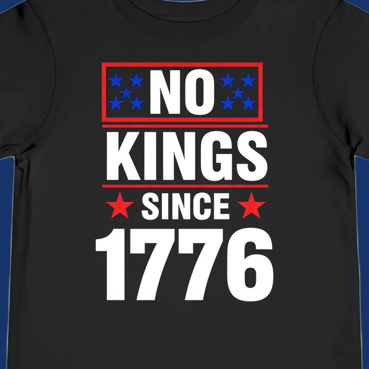 A patriotic design with the text 'NO KINGS SINCE 1776' in white and navy, featuring blue and red stars.