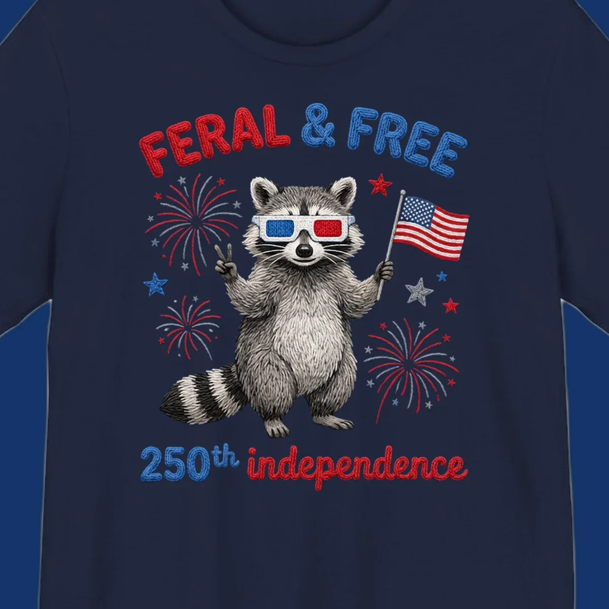 A playful raccoon in 3D glasses holds an American flag, surrounded by fireworks and stars, with "FERAL & FREE 250th independence".