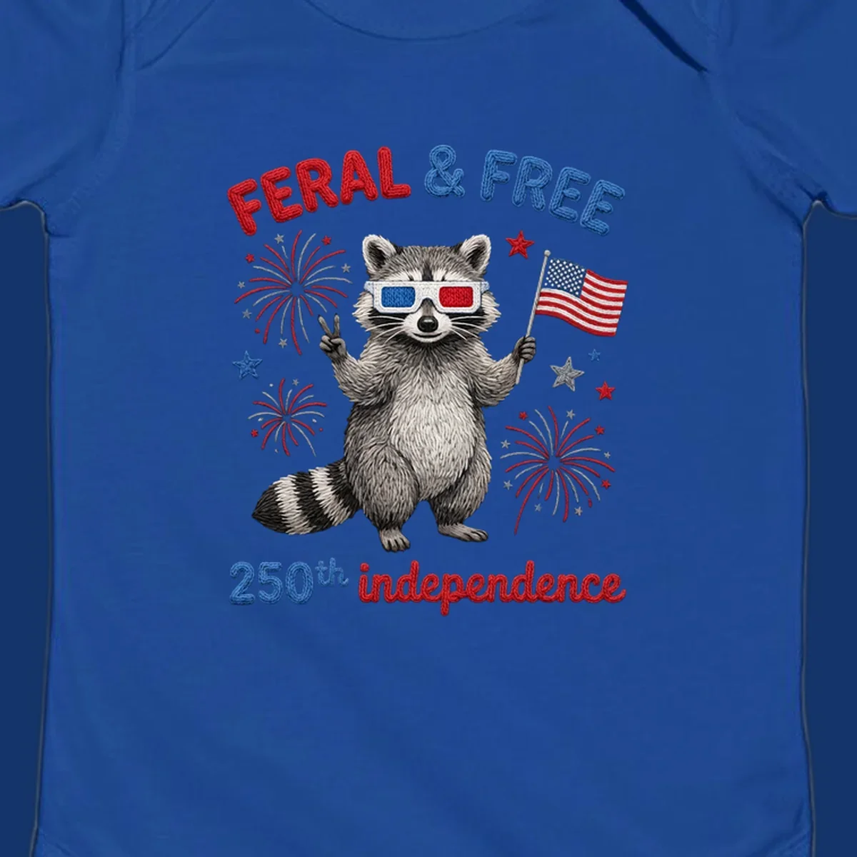 A "FERAL & FREE" raccoon in 3D glasses holds an American flag, surrounded by fireworks, celebrating 250th independence.