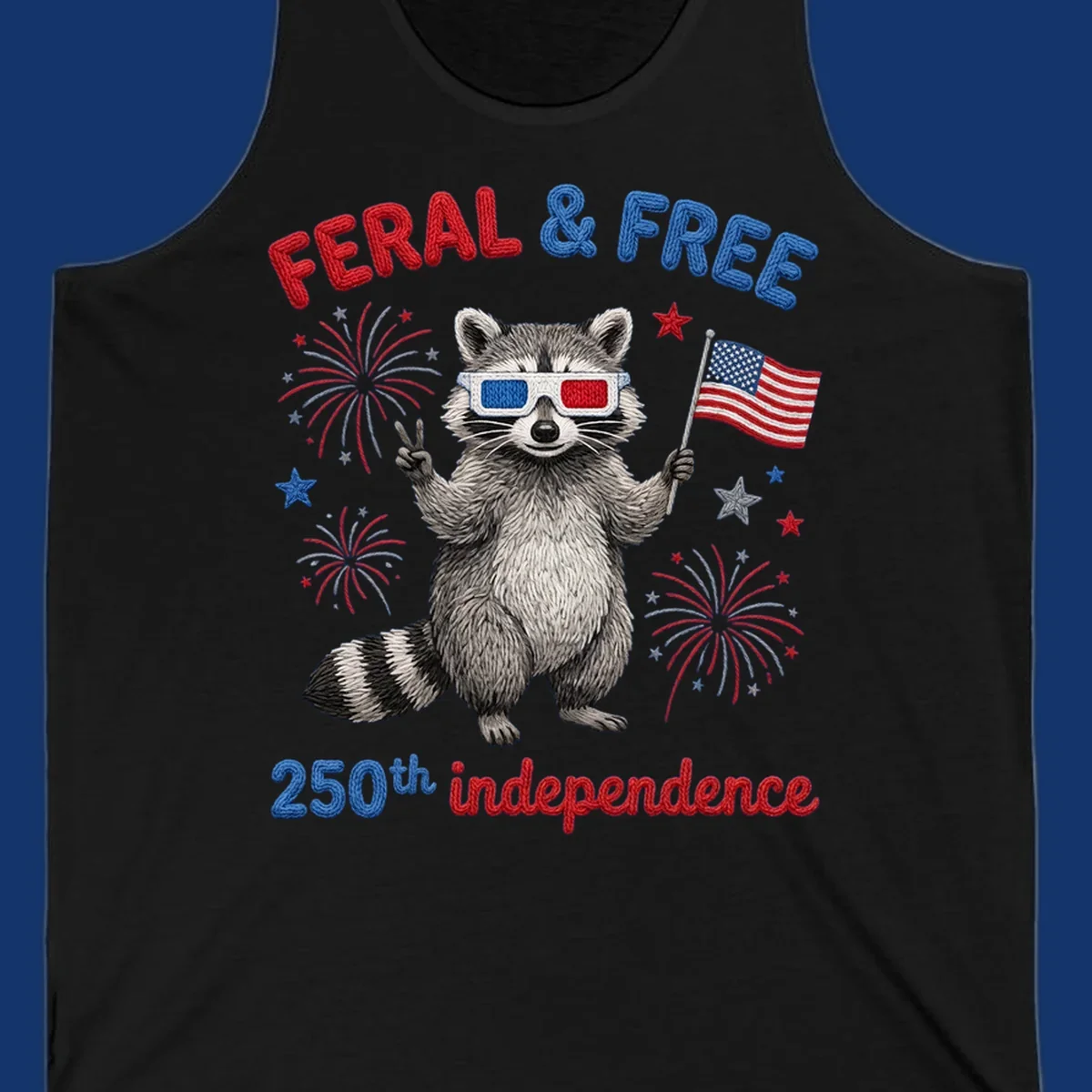 A "FERAL & FREE" raccoon in 3D glasses holds an American flag, surrounded by fireworks, celebrating 250th independence.