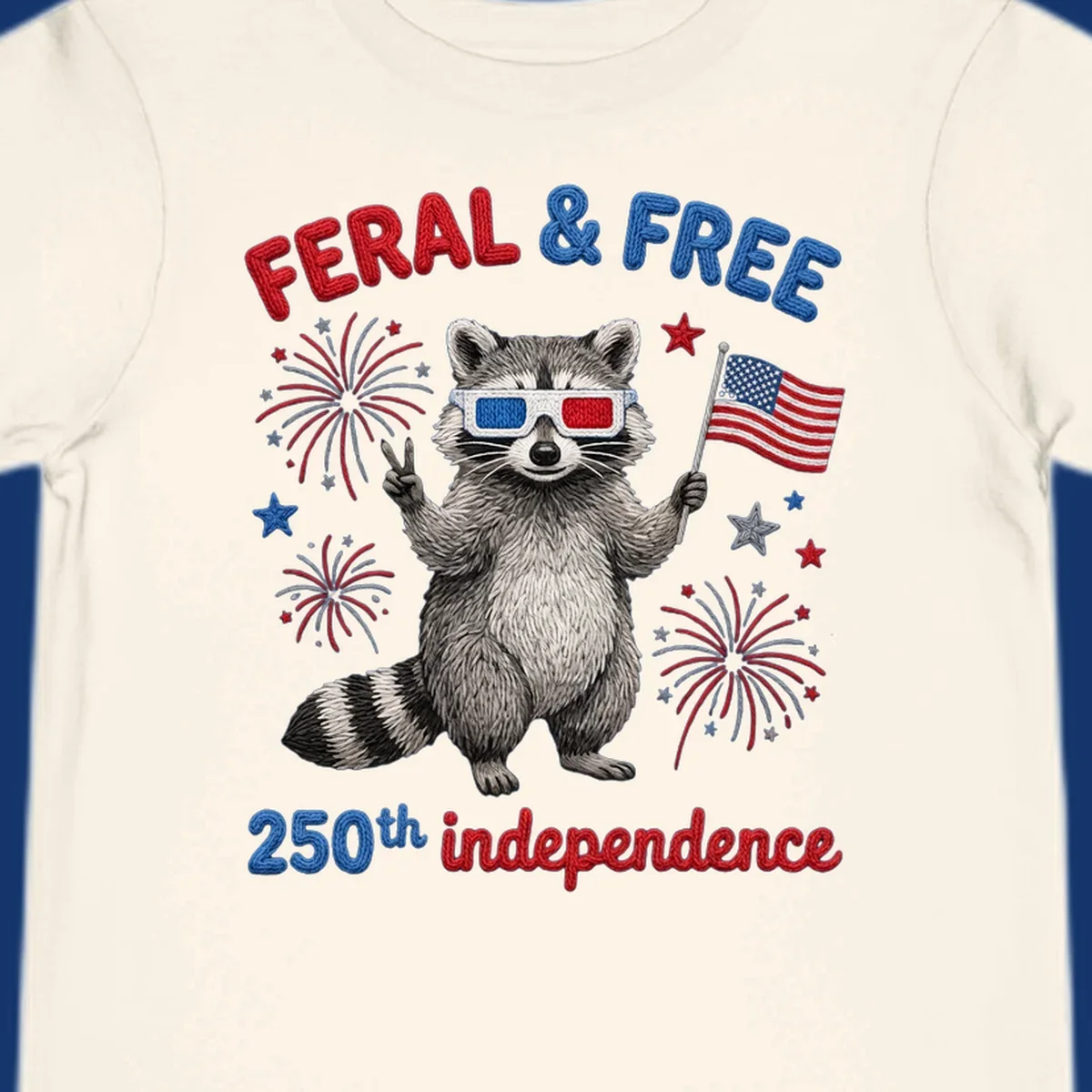 A "FERAL & FREE" raccoon in 3D glasses holds an American flag, surrounded by fireworks, celebrating 250th independence.