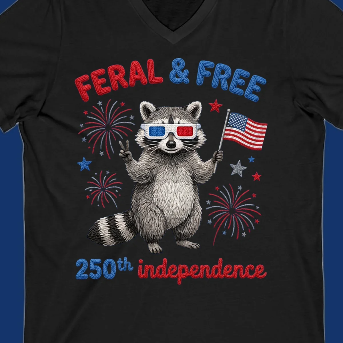 A "FERAL & FREE" raccoon in 3D glasses holds an American flag, surrounded by fireworks, celebrating 250th independence.
