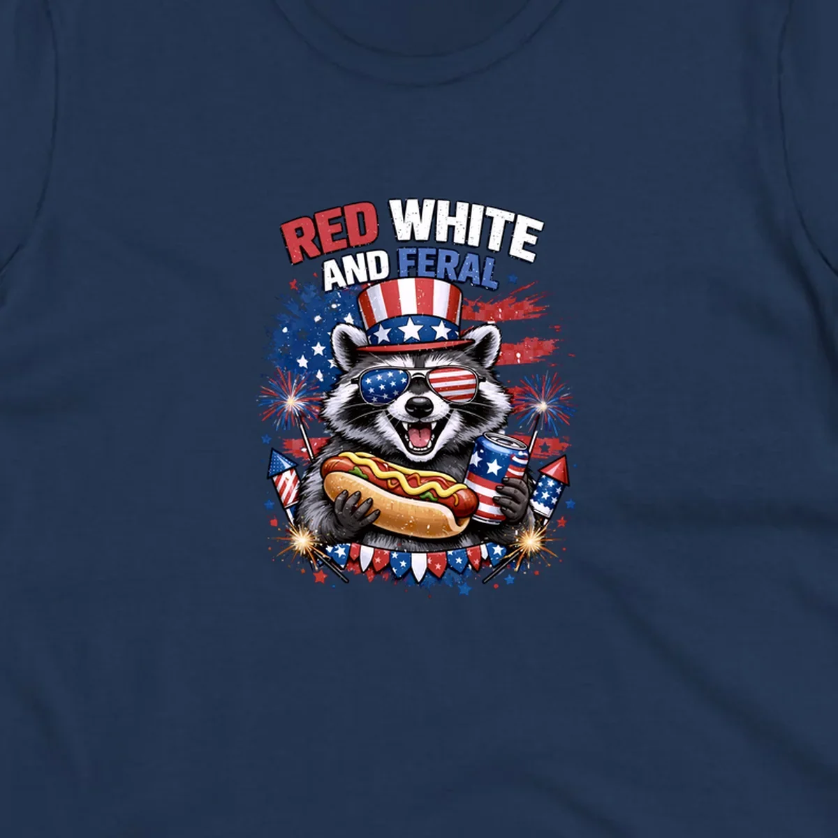 A patriotic raccoon wearing an American flag top hat and sunglasses, holding a hot dog and soda can, with the text 'RED WHITE AND FERAL' and fireworks.