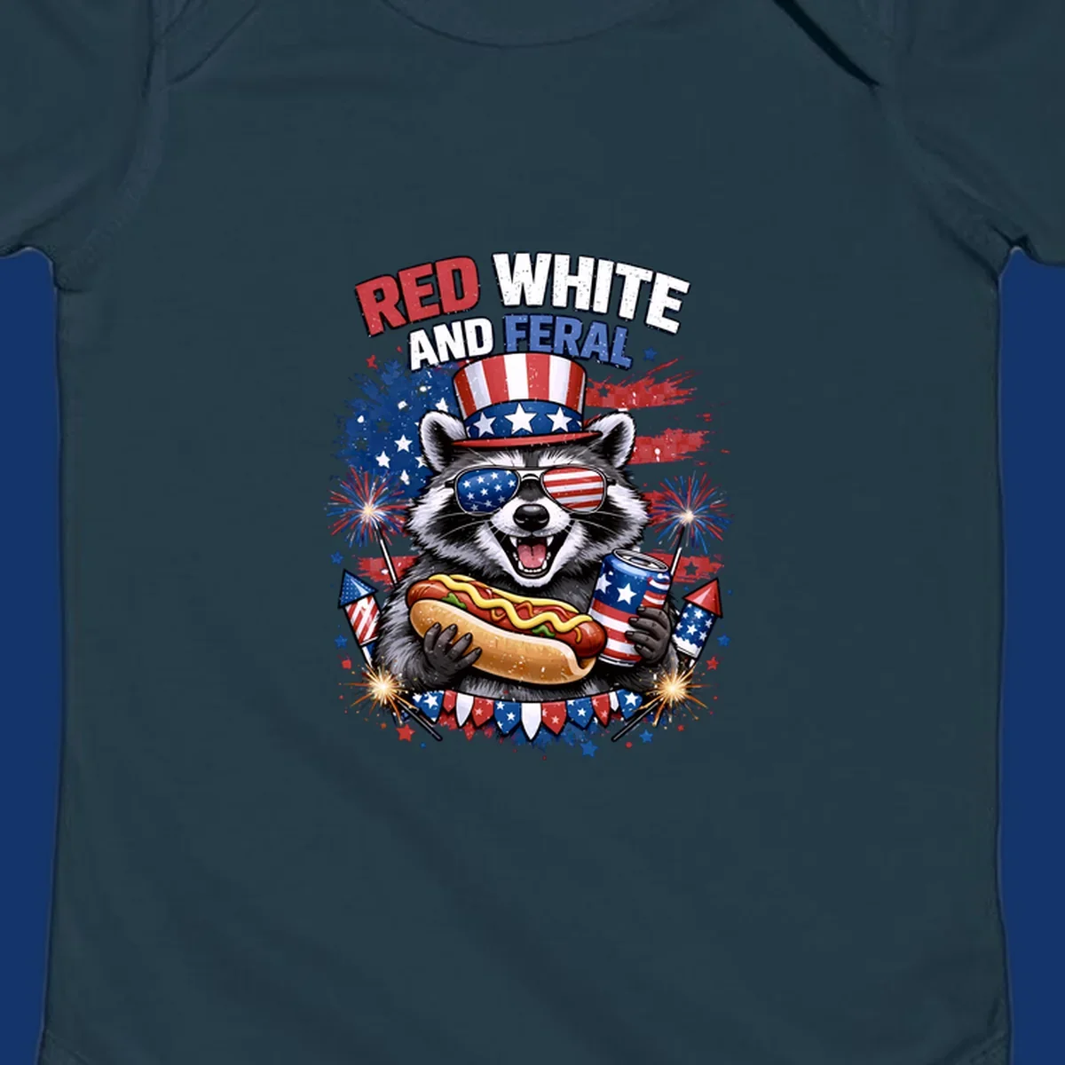 A patriotic raccoon wearing an American flag top hat and sunglasses, holding a hot dog and soda can, with the text 'RED WHITE AND FERAL' and fireworks.