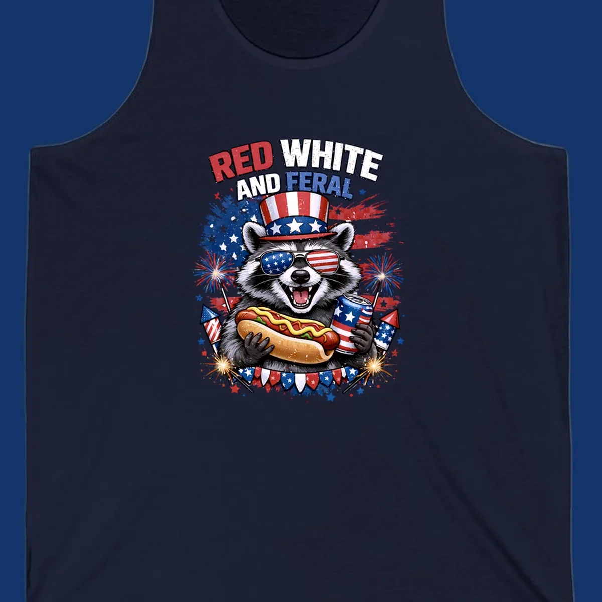 A patriotic raccoon wearing an American flag top hat and sunglasses, holding a hot dog and soda can, with the text 'RED WHITE AND FERAL' and fireworks.