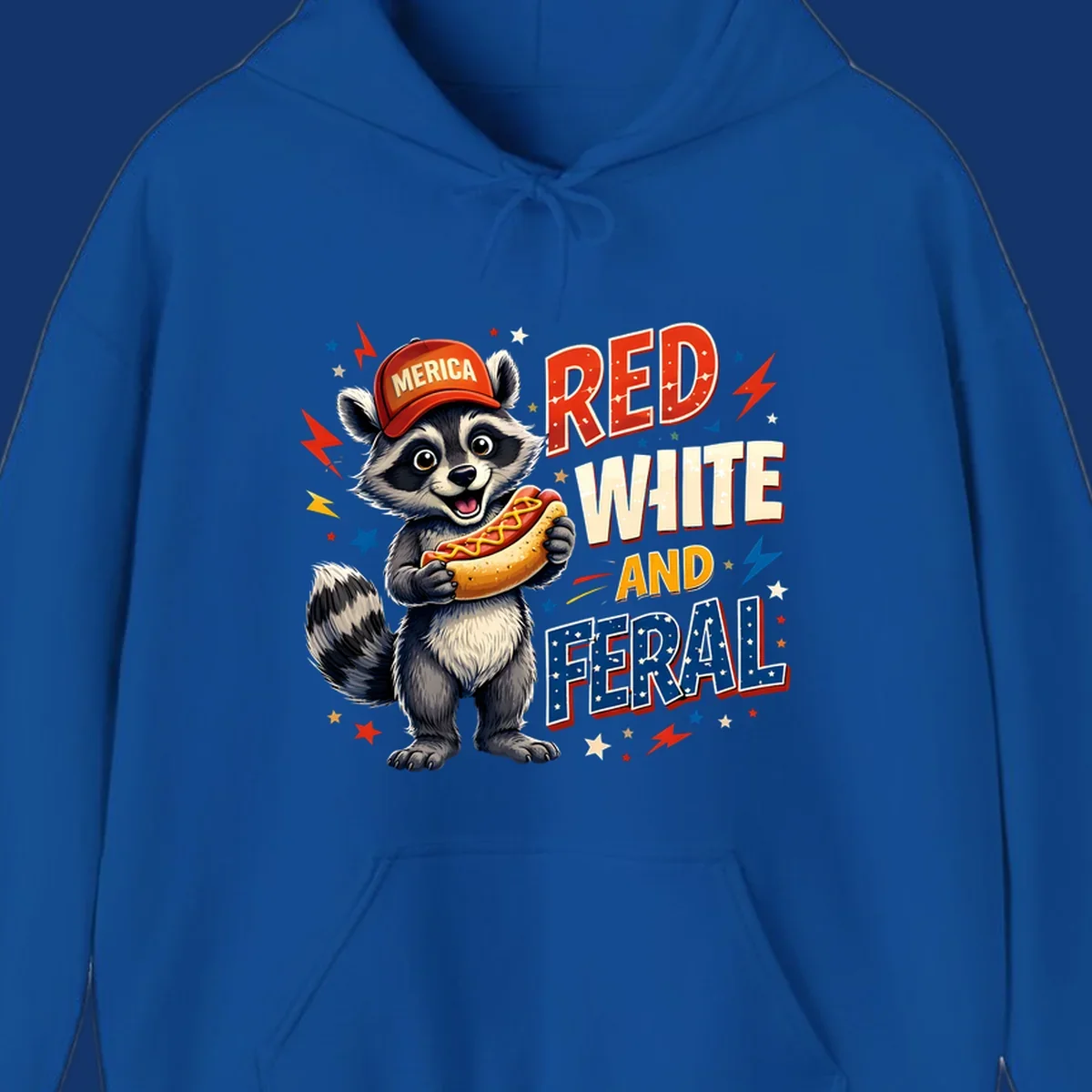 A happy raccoon in a 'MERICA' hat holds a hot dog, with 'RED WHITE AND FERAL' text, stars, and lightning bolts. Features a raccoon-merica-feral-hotdog theme.