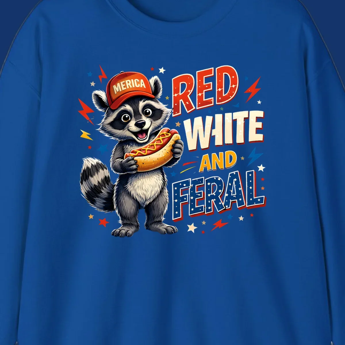 A happy raccoon in a 'MERICA' hat holds a hot dog, with 'RED WHITE AND FERAL' text, stars, and lightning bolts. Features a raccoon-merica-feral-hotdog theme.