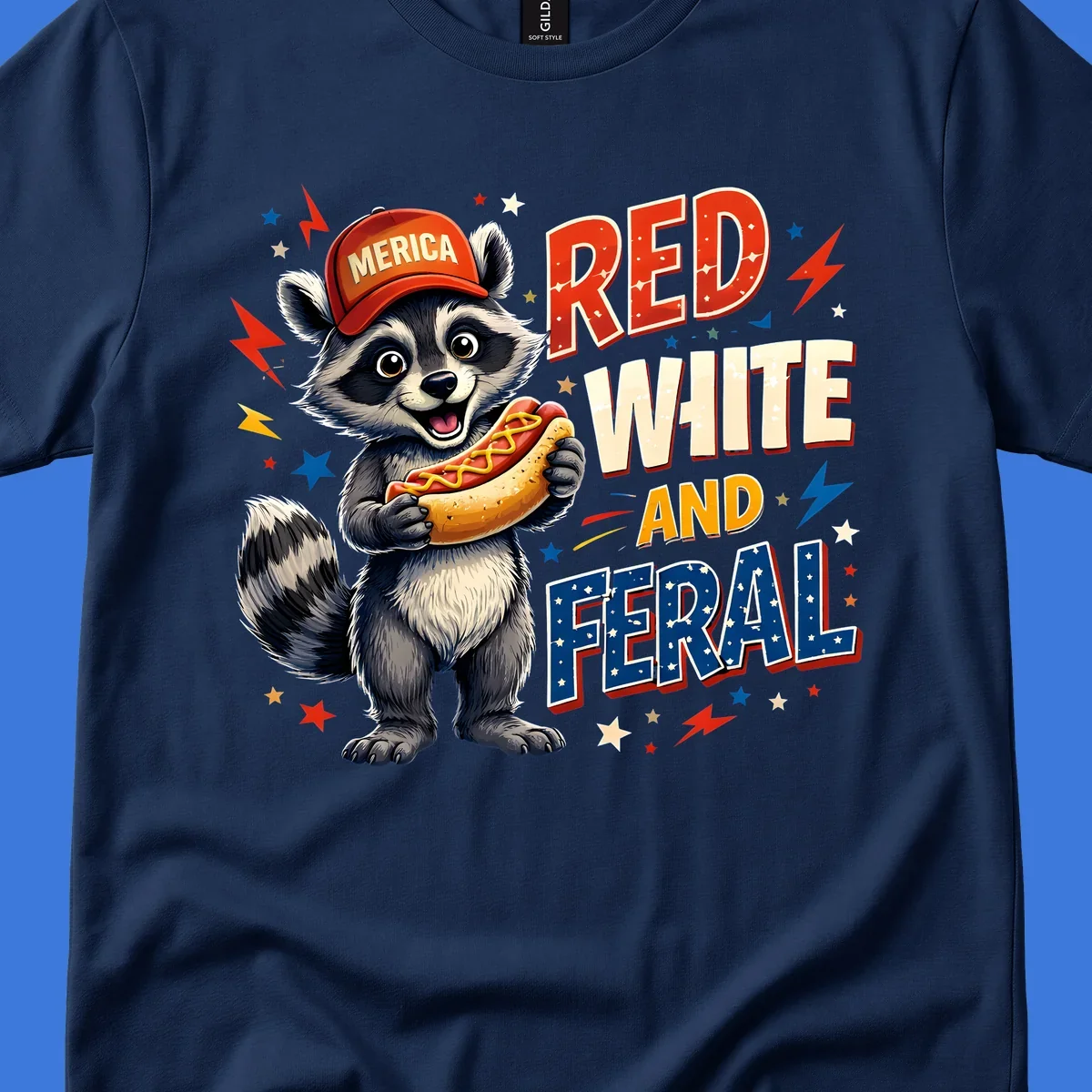A happy raccoon in a 'MERICA' hat holds a hot dog, with 'RED WHITE AND FERAL' text, stars, and lightning bolts. Features a raccoon-merica-feral-hotdog theme.