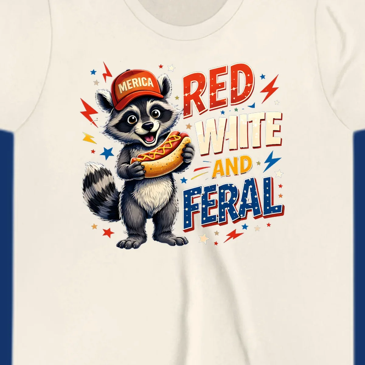 A happy raccoon in a 'MERICA' hat holds a hot dog, with 'RED WHITE AND FERAL' text, stars, and lightning bolts. Features a raccoon-merica-feral-hotdog theme.