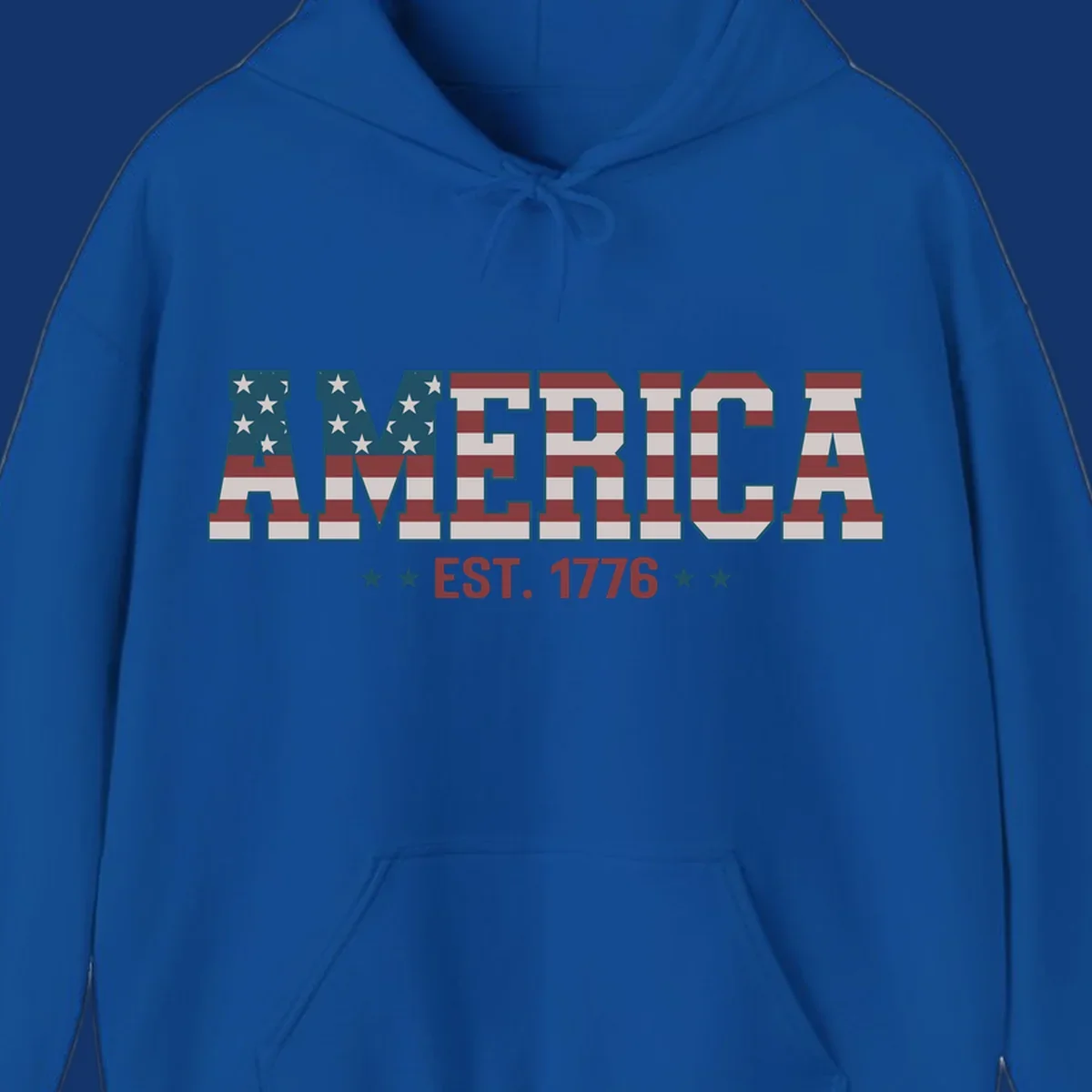 The word AMERICA in block letters, filled with an American flag pattern, above the text EST. 1776 with stars. Concept: america-est-1776-flag.