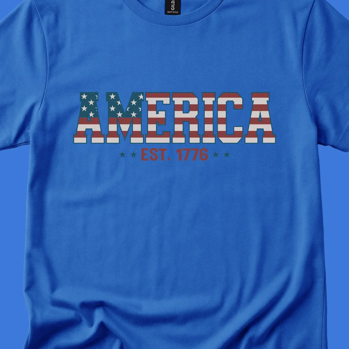The word AMERICA in block letters, filled with an American flag pattern, above the text EST. 1776 with stars. Concept: america-est-1776-flag.