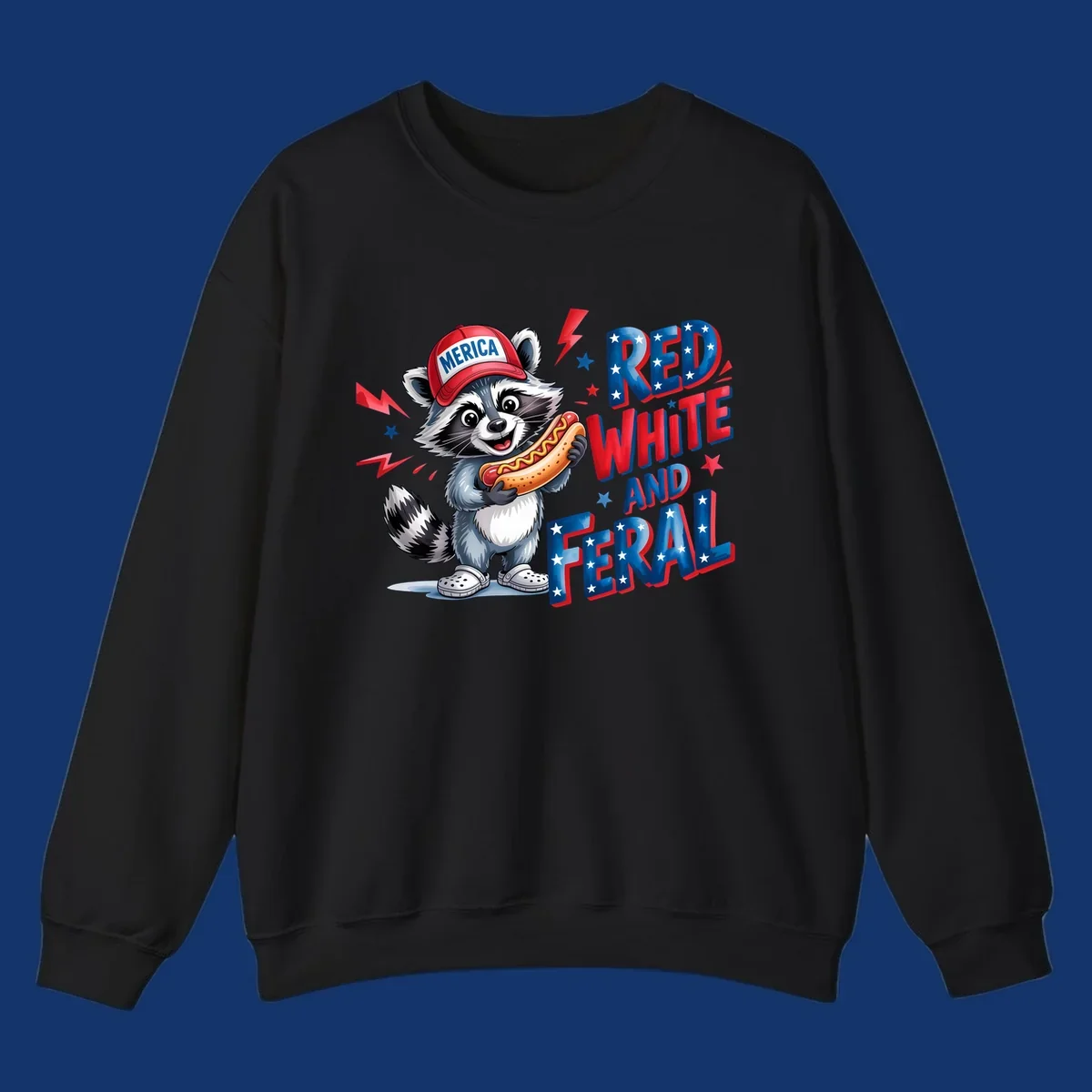 A cartoon raccoon wearing a 'MERICA' hat and holding a hot dog, next to text 'RED WHITE AND FERAL'. This is a raccoon-red-white-feral design.